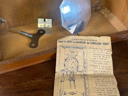 ODO.
Wood and metal chime with eight hammers.
55...