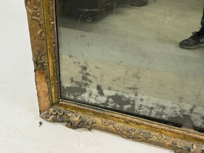 Carved wood mirror with foliate scrolls.
93...