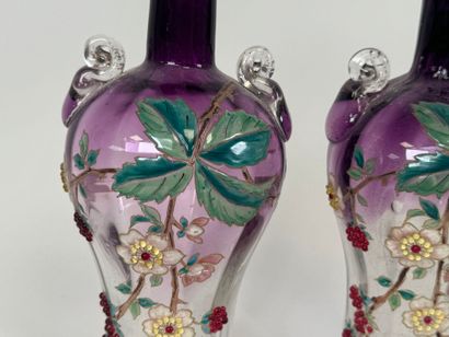 Pair of vases in partially colored and enameled...