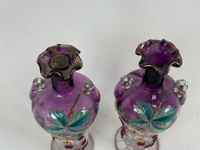 Pair of vases in partially colored and enameled...
