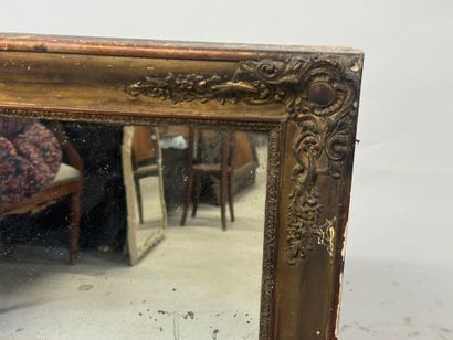 Wood and gilded stucco mirror with foliate...