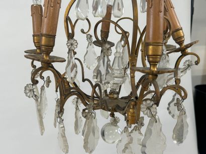 Six-arm bronze chandelier with crystal pendants.
H....