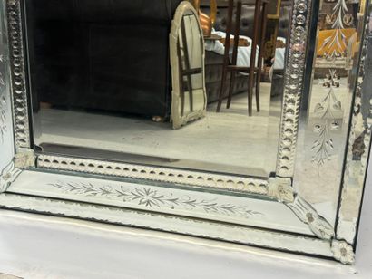 Large Venetian mirror with richly foliated...