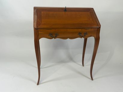 Cherrywood sloping desk opening with a flap...