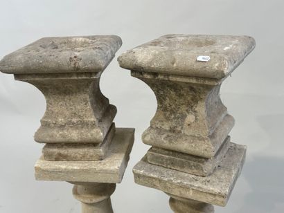 Pair of stone baluster columns, square base.
61...