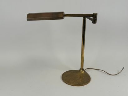 Brass desk lamp, swivel arm, circular base.
H....