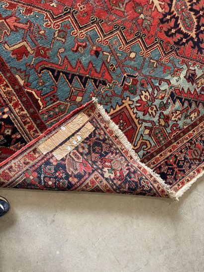 Large hand-knotted wool rug decorated with...