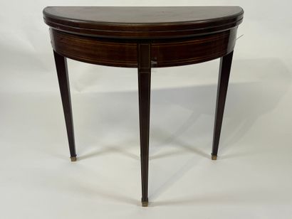Mahogany veneered half-moon game table.
Louis...
