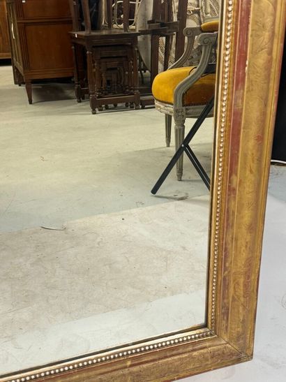 Wood and gilded stucco mirror decorated with...