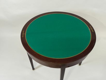 Mahogany veneered half-moon game table.
Louis...