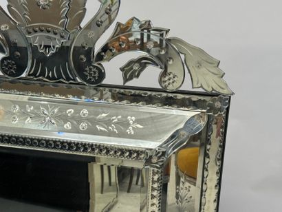 Large Venetian mirror with richly foliated...