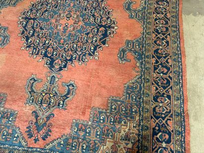 Large hand-knotted wool rug with stylized...