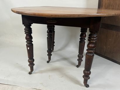 Two-leaf table with six molded wood legs.
73...