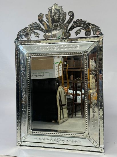 Large Venetian mirror with richly foliated...