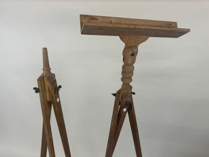Two wooden tripods, one with a telescope...
