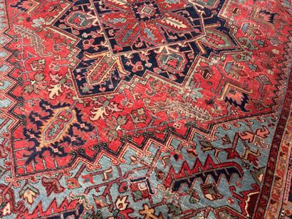 Large hand-knotted wool rug decorated with...