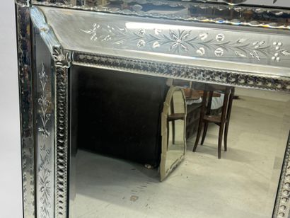Large Venetian mirror with richly foliated...