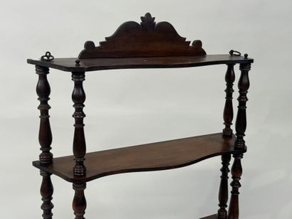 Small four-tier wall shelf in turned wood.
78...