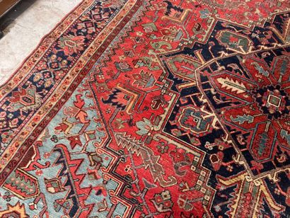 Large hand-knotted wool rug decorated with...