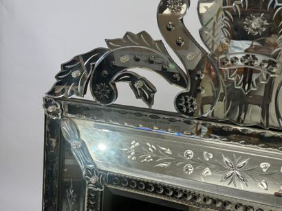 Large Venetian mirror with richly foliated...