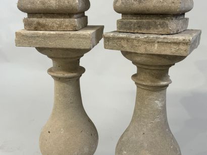 Pair of stone baluster columns, square base.
61...