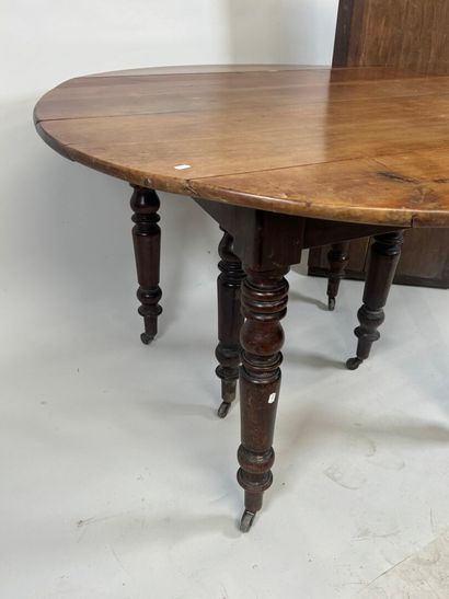 Two-leaf table with six molded wood legs.
73...