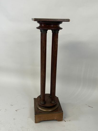 Moulded wood and brass sellette with four...