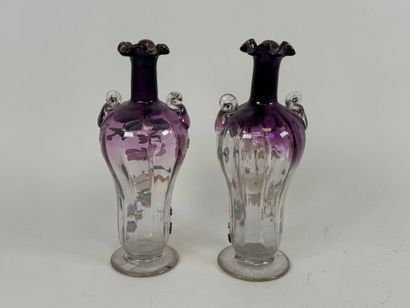 Pair of vases in partially colored and enameled...