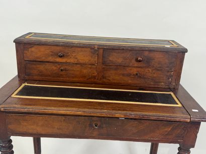 Stained wood stepped desk opening with a...