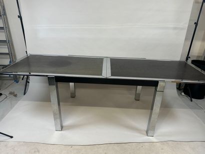 Extendable table in stained wood and chrome.
70s.
73...