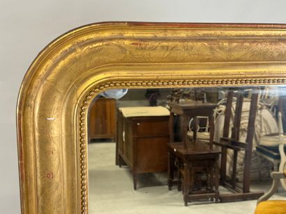 Wood and gilded stucco mirror decorated with...