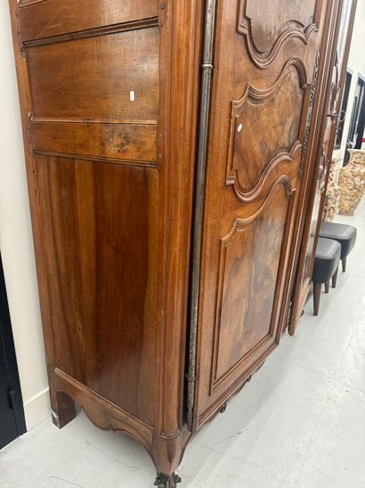 Large walnut armoire opening with two molded...