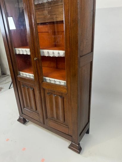 Stained-wood display case opening with two...