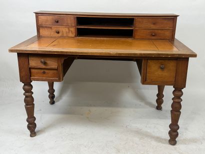 Tiered desk in molded wood opening with three...