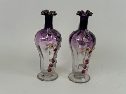 Pair of vases in partially colored and enameled...