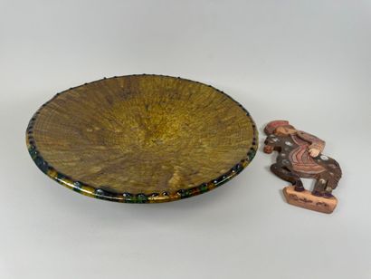 Large circular dish on heel in glazed ceramic...