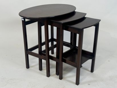 Moulded mahogany nesting tables, one brace...