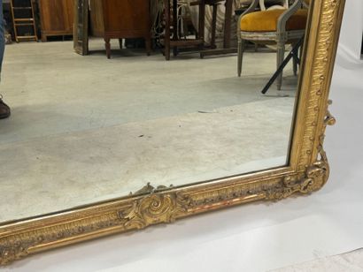 Large gilded and carved wood mirror with...