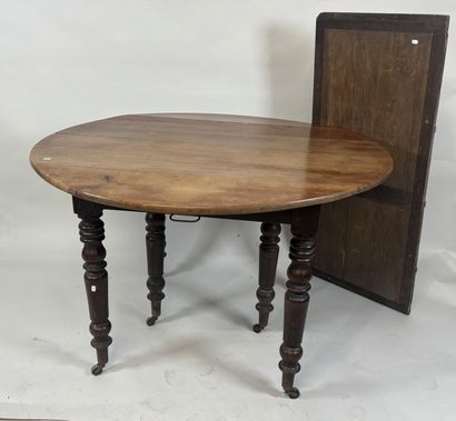 Two-leaf table with six molded wood legs.
73...