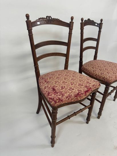 Pair of chairs in molded wood, the openwork...