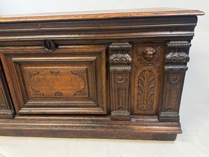 Large molded and carved oak desk decorated...