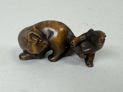 JAPON, XXe.
Netsuké en bois sculpté figurant...