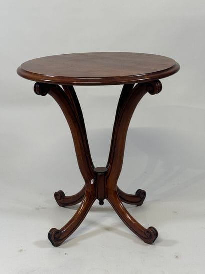 Circular cherrywood pedestal table with scrolls.
20th...