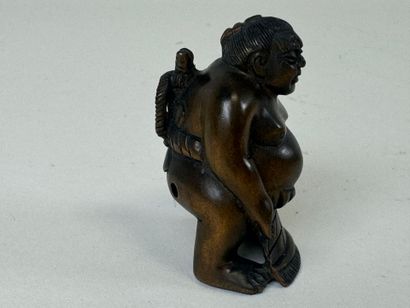 JAPON, XXe.
Netsuké en bois sculpté figurant...