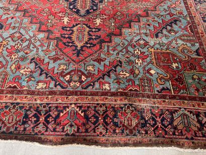 Large hand-knotted wool rug decorated with...