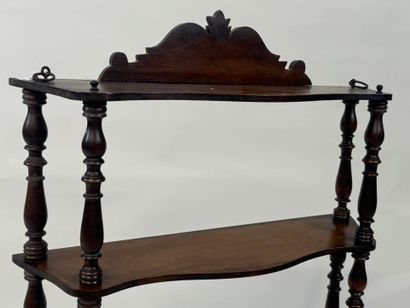 Small four-tier wall shelf in turned wood.
78...