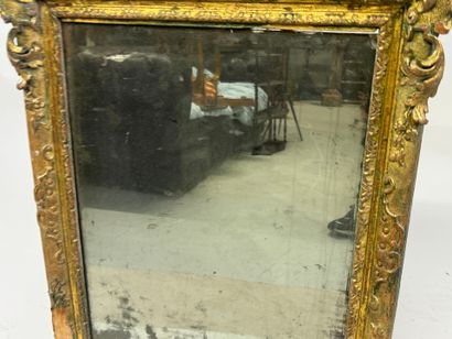 Carved wood mirror with foliate scrolls.
93...