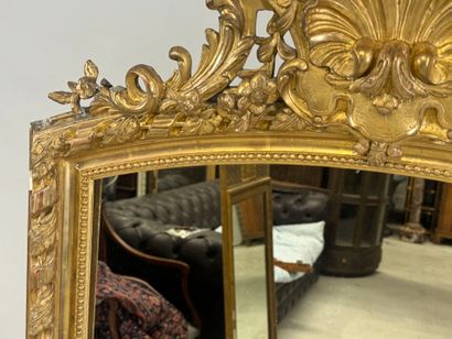 Large wood and gilded stucco mirror with...