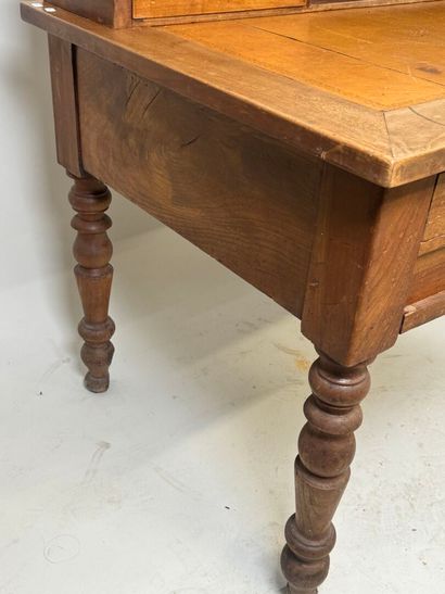 Tiered desk in molded wood opening with three...