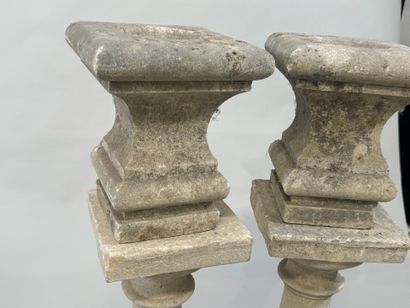 Pair of stone baluster columns, square base.
61...